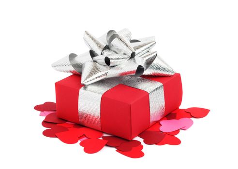 Valentines Day gift in red box and small hearts isolated on white