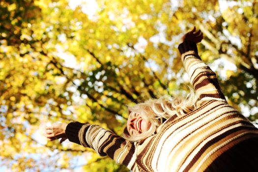 autumn woman hands in the air