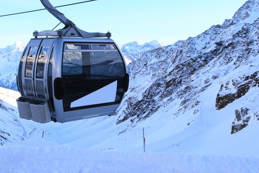 Chairlift in winter mountains at winter time