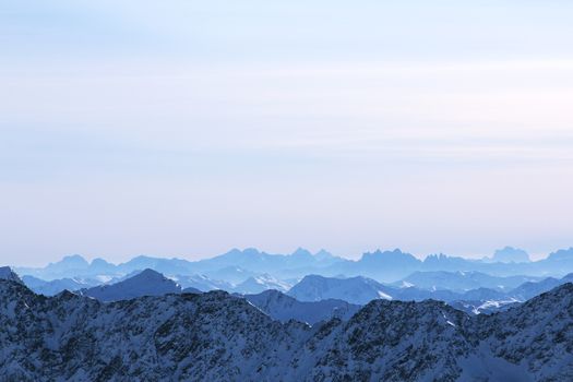 Beautiful panorama of mountain peaks in winter