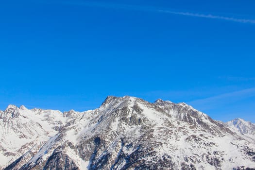 High mountains under blue sky beautiful winter panorama