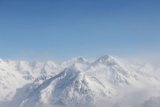 Winter alpine mountains covered with snow