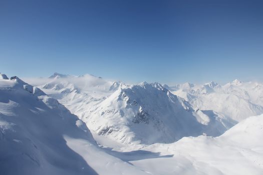 Winter alpine mountains covered with snow