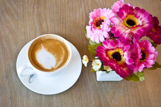 hot latte with artificial flower