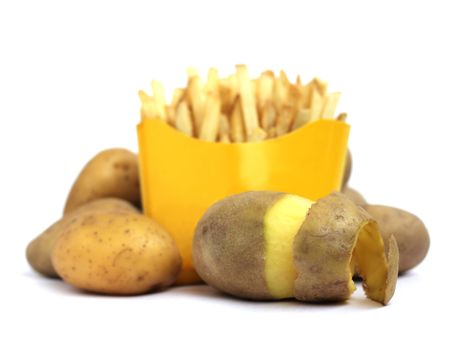 French fries in box with peeled potato isolated on white background