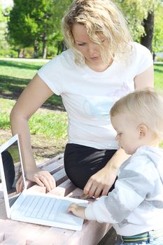 young mother and child with laptop