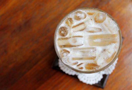 Iced coffee on wooden table