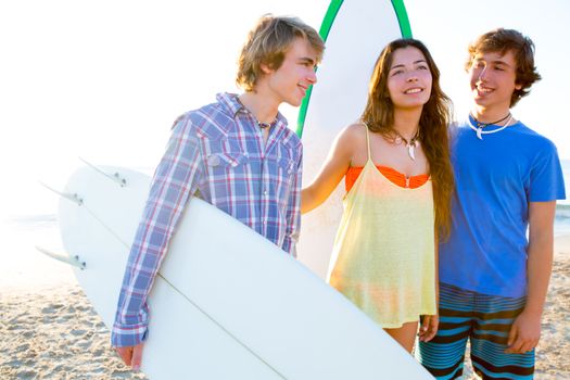 Teenager surfers group happy in beach shore high key