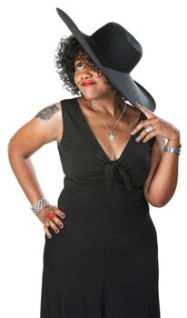Daydreaming mature African woman in black on isolated background