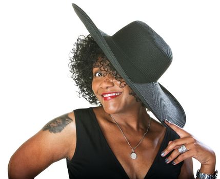 Excited mature woman with large hat and tattoo