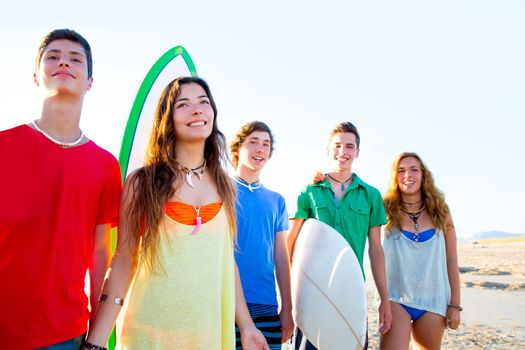 Teenager surfers boys and girls group happy in beach shore high key