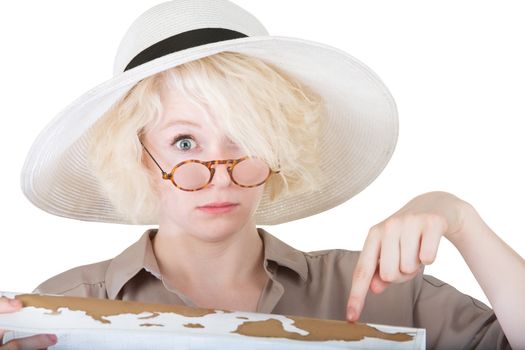 Nervous female tourist pointing at map on white background