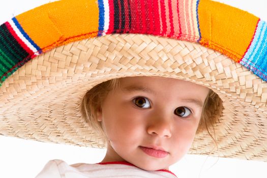 Welcome to Mexico says little girl with her Mexican hat and big brown eyes