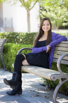 Happy Mixed Race Female Student Portrait on School Campus Bench.