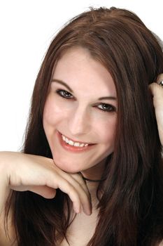 A close-up of a lovely young brunette with a bright, warm smile.