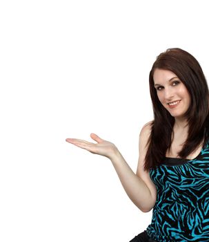 A lovely young brunette hostess points to your product or information.  Or she can hold it in her hand.  Isolated on a white background with generous copyspace.