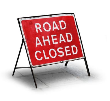 Grungy road closed sign isolated on white background
