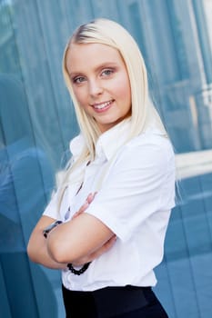 attractive young successful smiling business woman standing outdoor in summer 