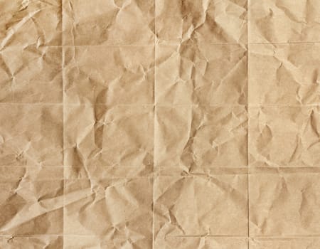 Old brown wrinkled paper crumpled rough texture background