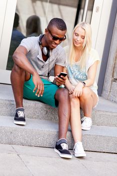 happy young couple have fun in the city summertime outdoor smiling lifestyle