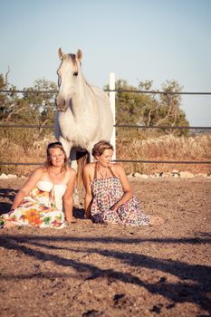 two woman horse and dog outdoor in summer happy sunset together nature