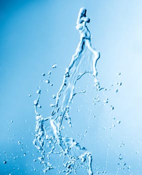 Drops and splashes of water on a blue background