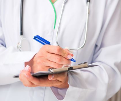 doctor's hands with a plane-table and writing pen