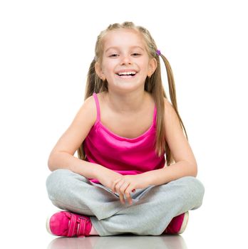 Smiling Little girl gymnast in studio over white background