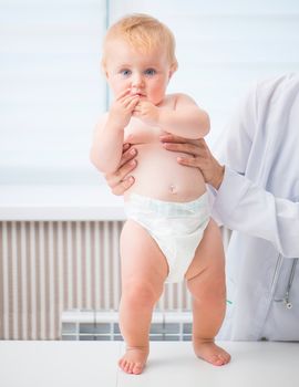 Cute baby at the doctor pediatrician