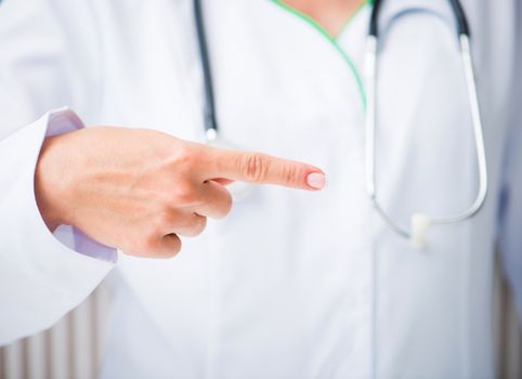 Doctor shows his index finger
