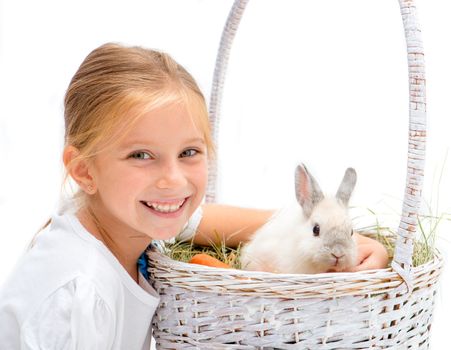 Smiling Little girl with a rabbit in basket