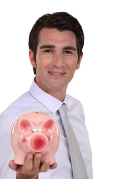 Man showing piggy bank