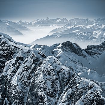 Snowy mountains in the Swiss Alps. View from Mount Titlis, Switzerland.