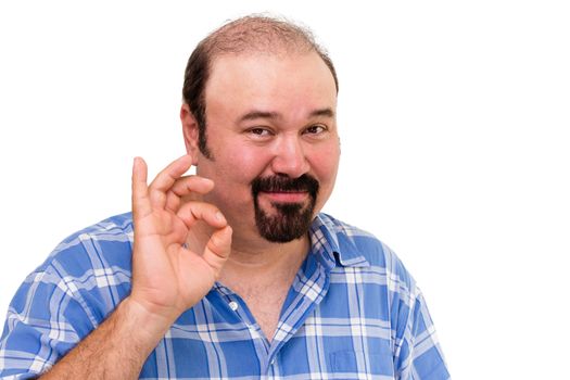Smiling man making a Perfect gesture with his fingers to signify his approval of a superb product or job isolated on white