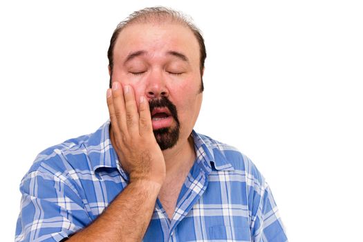 Lethargic lazy man with his hand raised to his cheek and eyes closed and a bored disinterested expression isolated on white