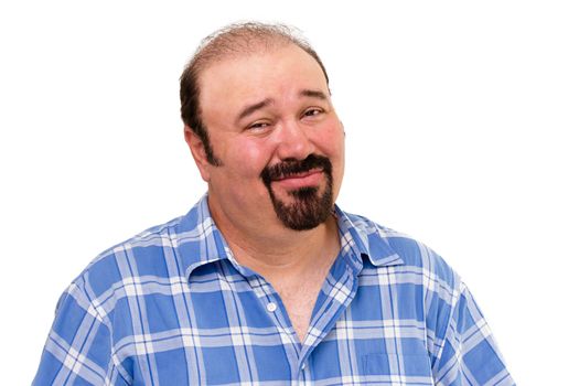 Overweight man with a goatee beard and a skeptical expression looking at the camera with his eyebrows raised in distrust and a cynical smile, isolated on white