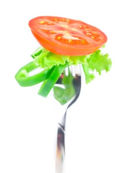 tomato ,lettuce,fork ,cucumber and pepper isolated on white