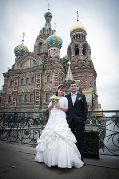 bride and groom near the temple