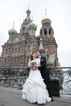 bride and groom near the temple