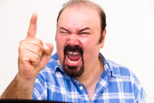 Horizontal portrait of an angry middle-aged Caucasian man screaming and threatening, isolated on white background