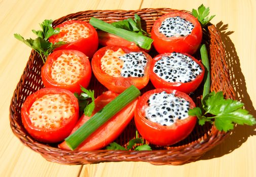 Tasty dish from tomato with stuffing and salad