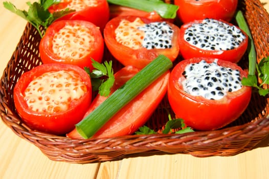 Tasty dish from tomato with stuffing and salad