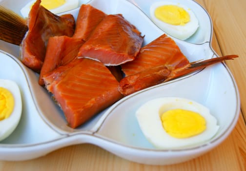 Fish Dish with egg on plate.Red fish