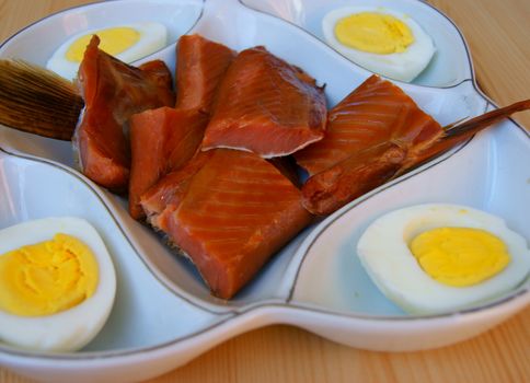 Fish Dish with egg on plate.Red fish