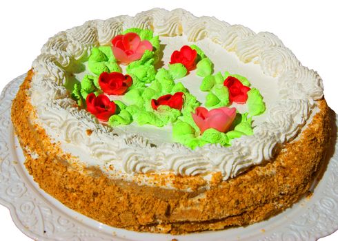 Birthday cake with white and red icing isolated on white