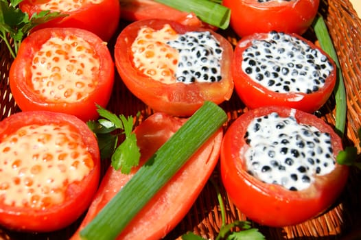 Tasty dish from tomato with stuffing and salad