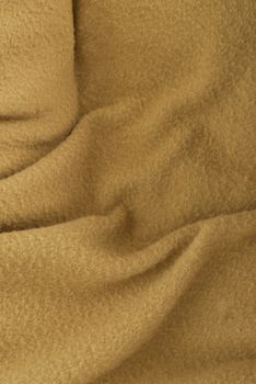 worn fabric background - beige polar fleece