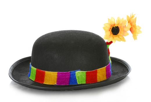 clown hat with colorful ribbon and flowers on white background