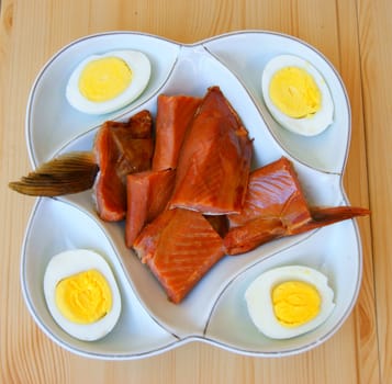 Fish Dish with egg on plate.Red fish