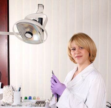 female dentist in dental office